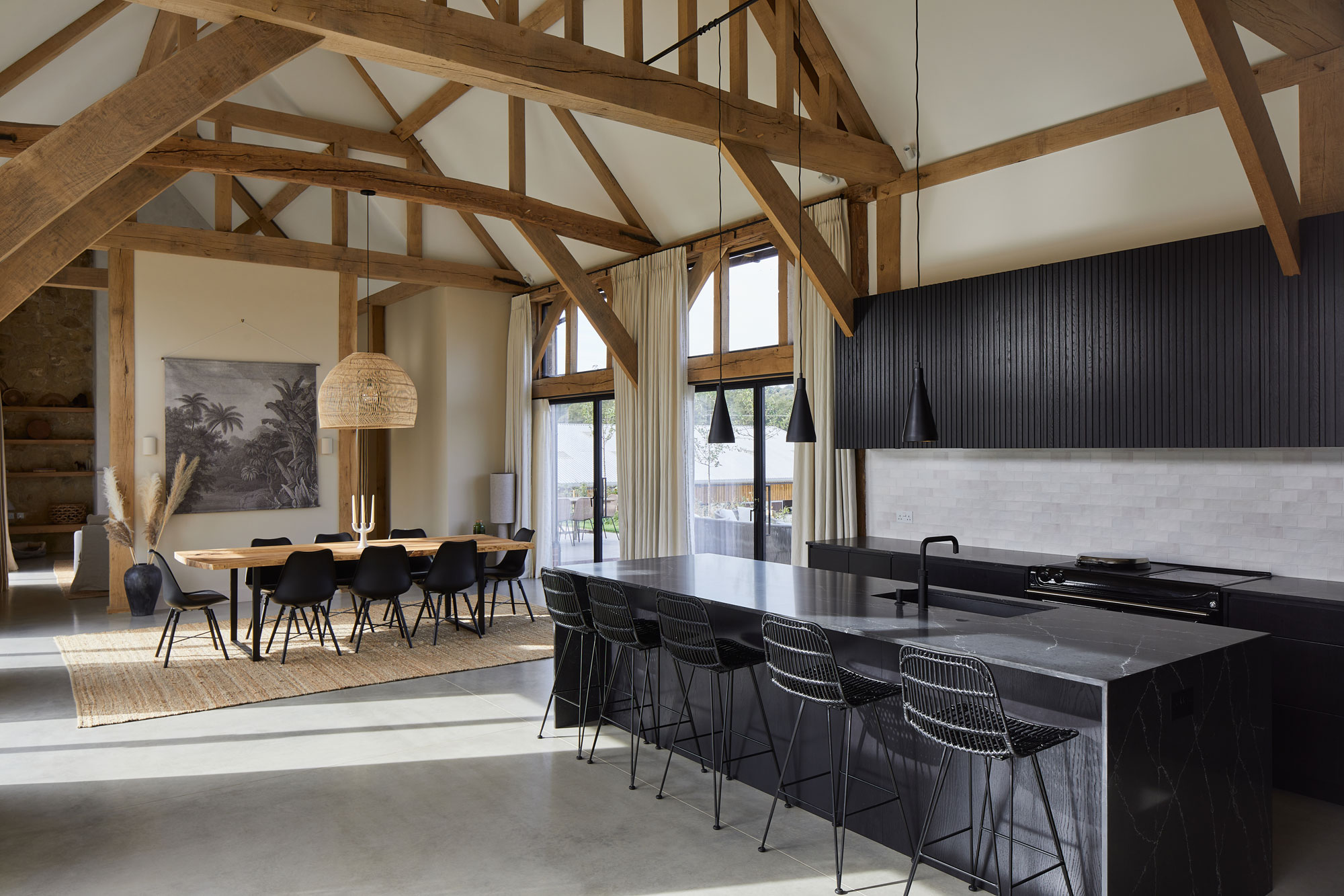 The sleek modern kitchen contrast with the traditional timbers and exterior